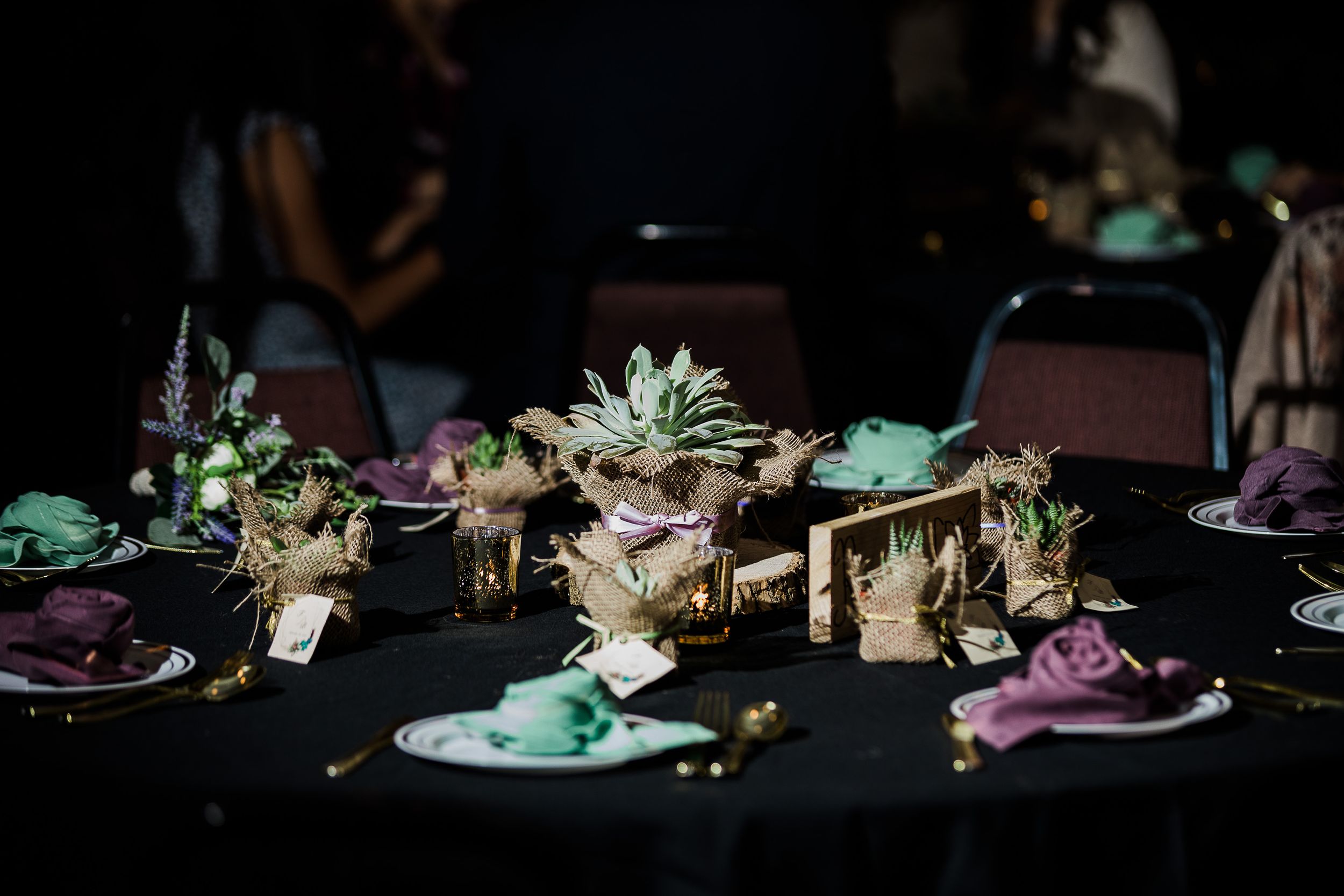 Wedding table setting of succulents with purple and green accents by Hudson Valley photographer