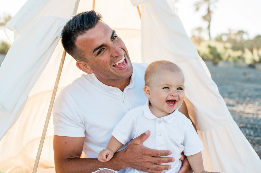 Daddy and boy smiling at the camera