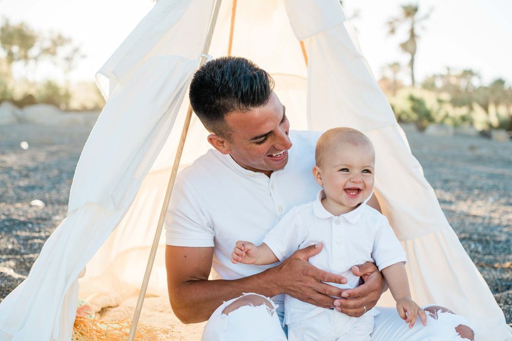 Daddy and his baby boy together smiling