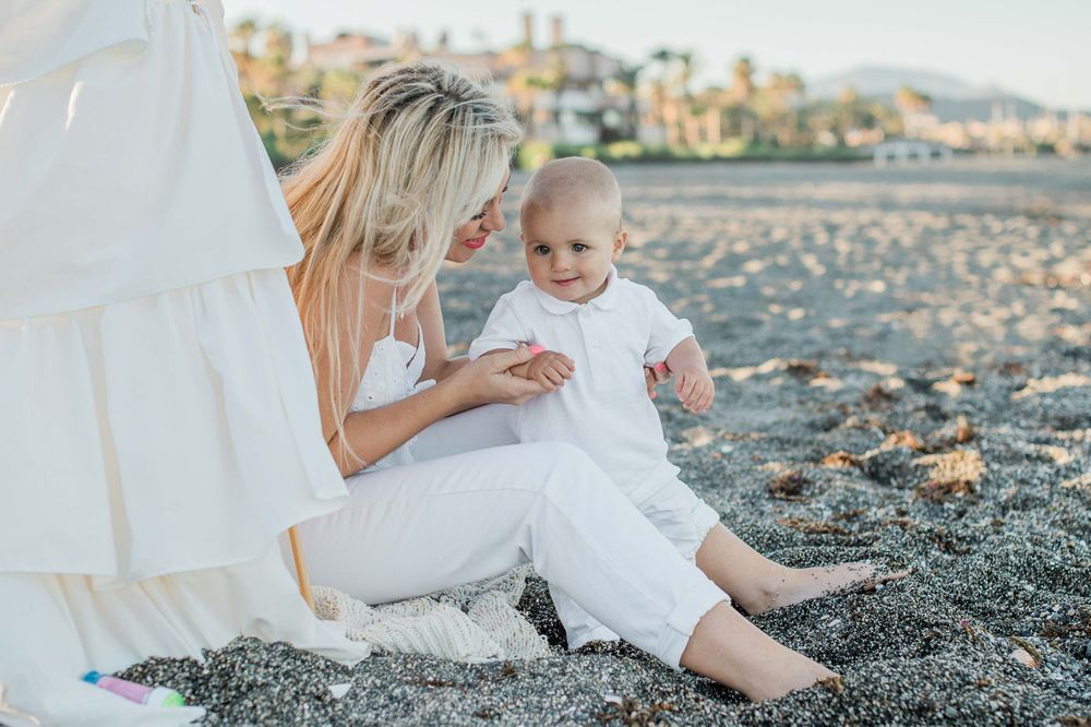 Portrait of a mother and a baby boy on the beach in Sotogrande