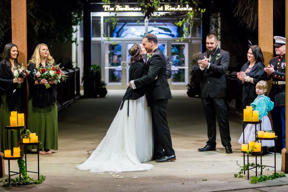 Bride and groom have their first kiss during their wedding ceremony at Riverbanks Zoo in Columbia, SC