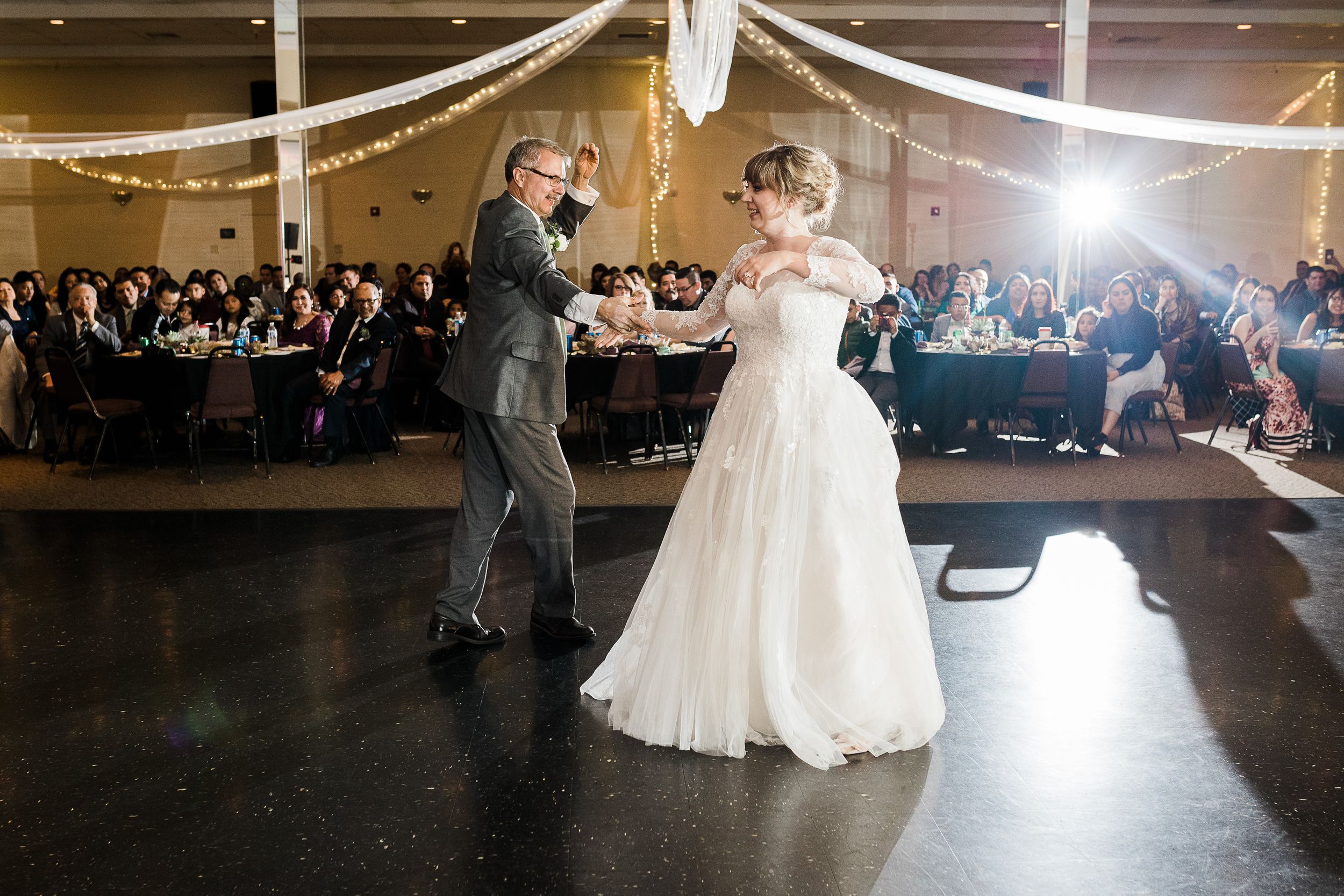 Bride and her father swing dance at wedding reception by Hudson Valley photographer