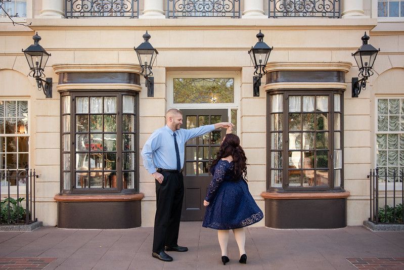 A couple twirling at the UK Pavilion at Walt Disney World's Epcot in Orlando FL