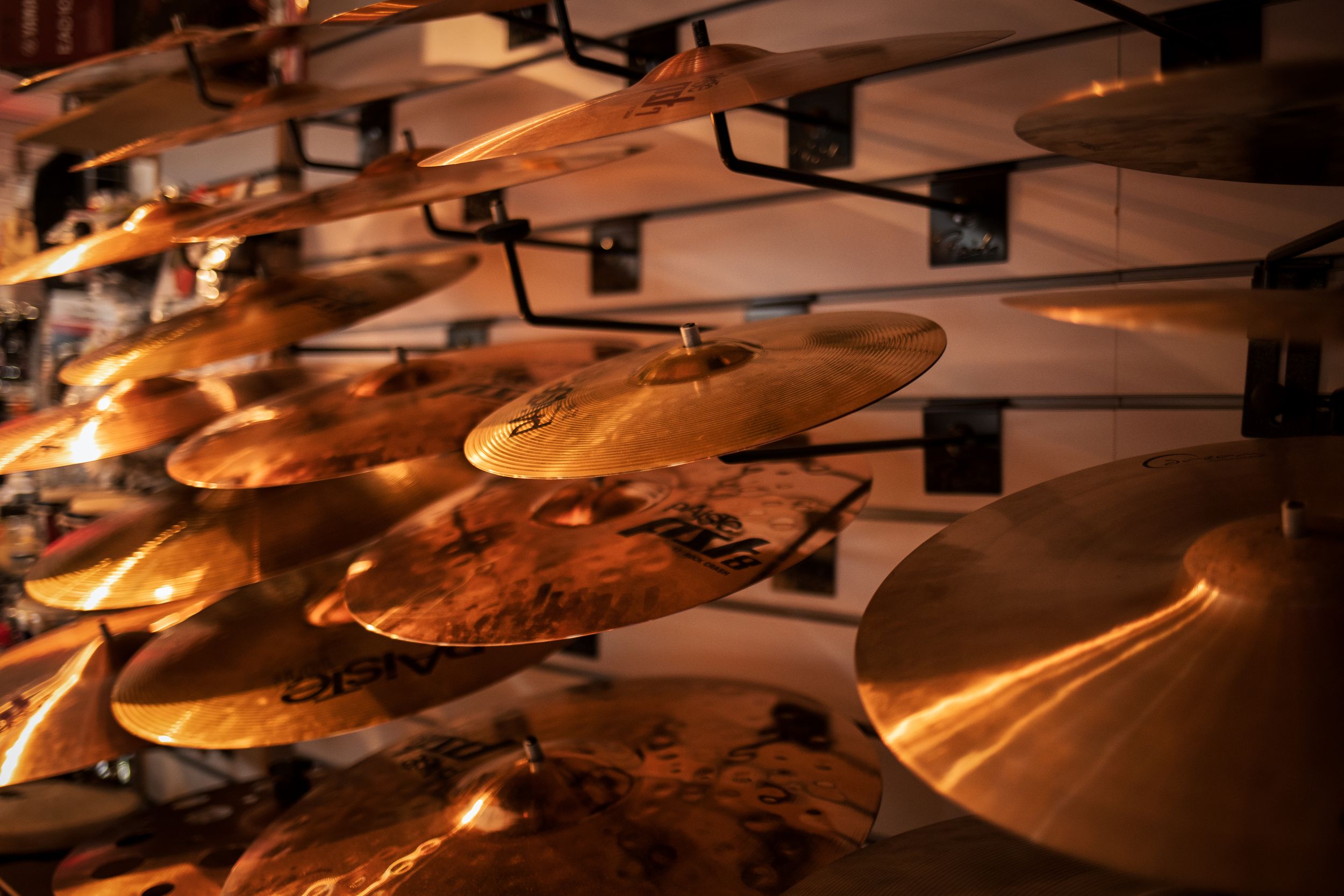 Light falling beautifully on this rack of Cymbals.