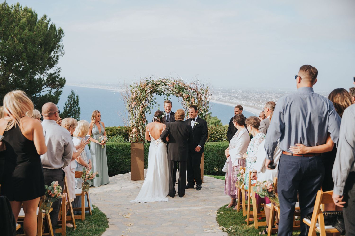 father giving bride away at ceremony