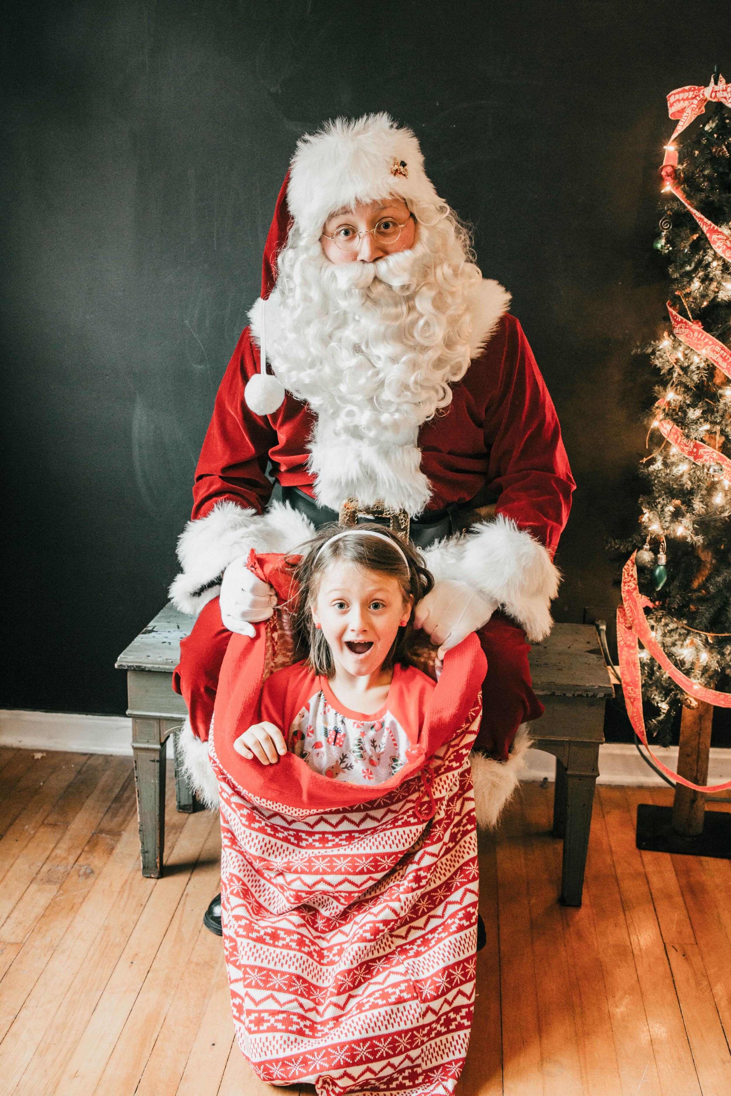 Santa with Child in his toy bag, Shiny Penny Studios, Cleveland
