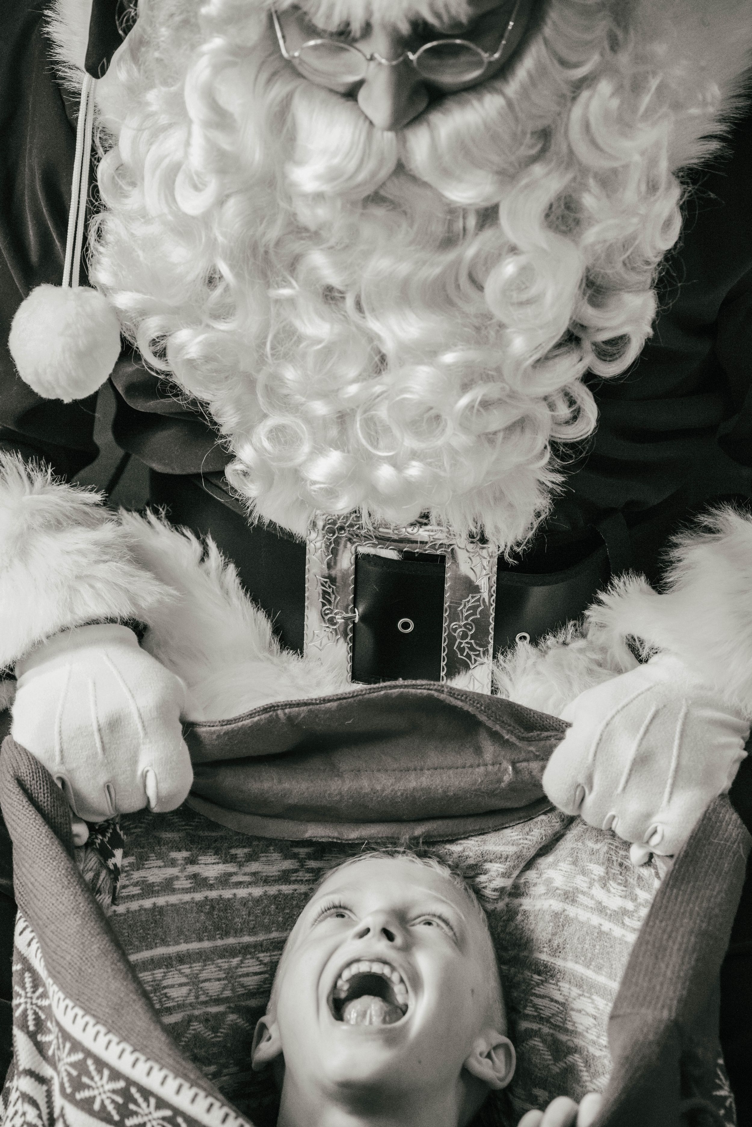 Santa with Child in his toy bag, Shiny Penny Studios, Cleveland