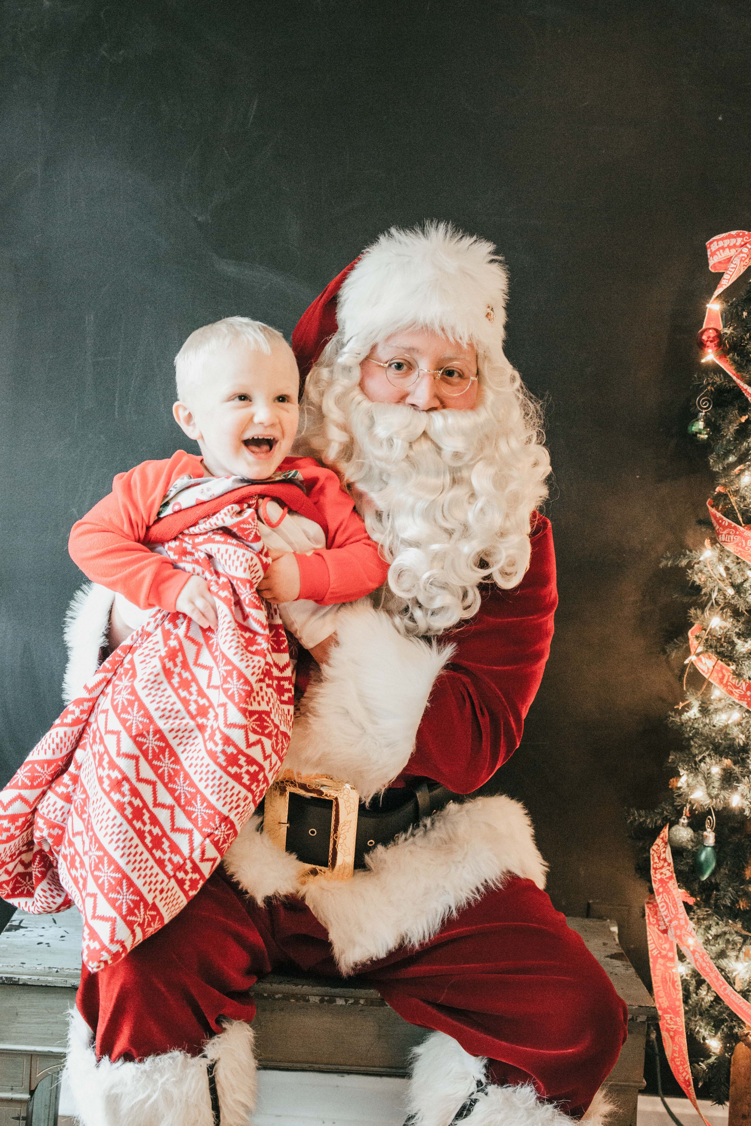 Santa with Child in his toy bag, Shiny Penny Studios, Cleveland