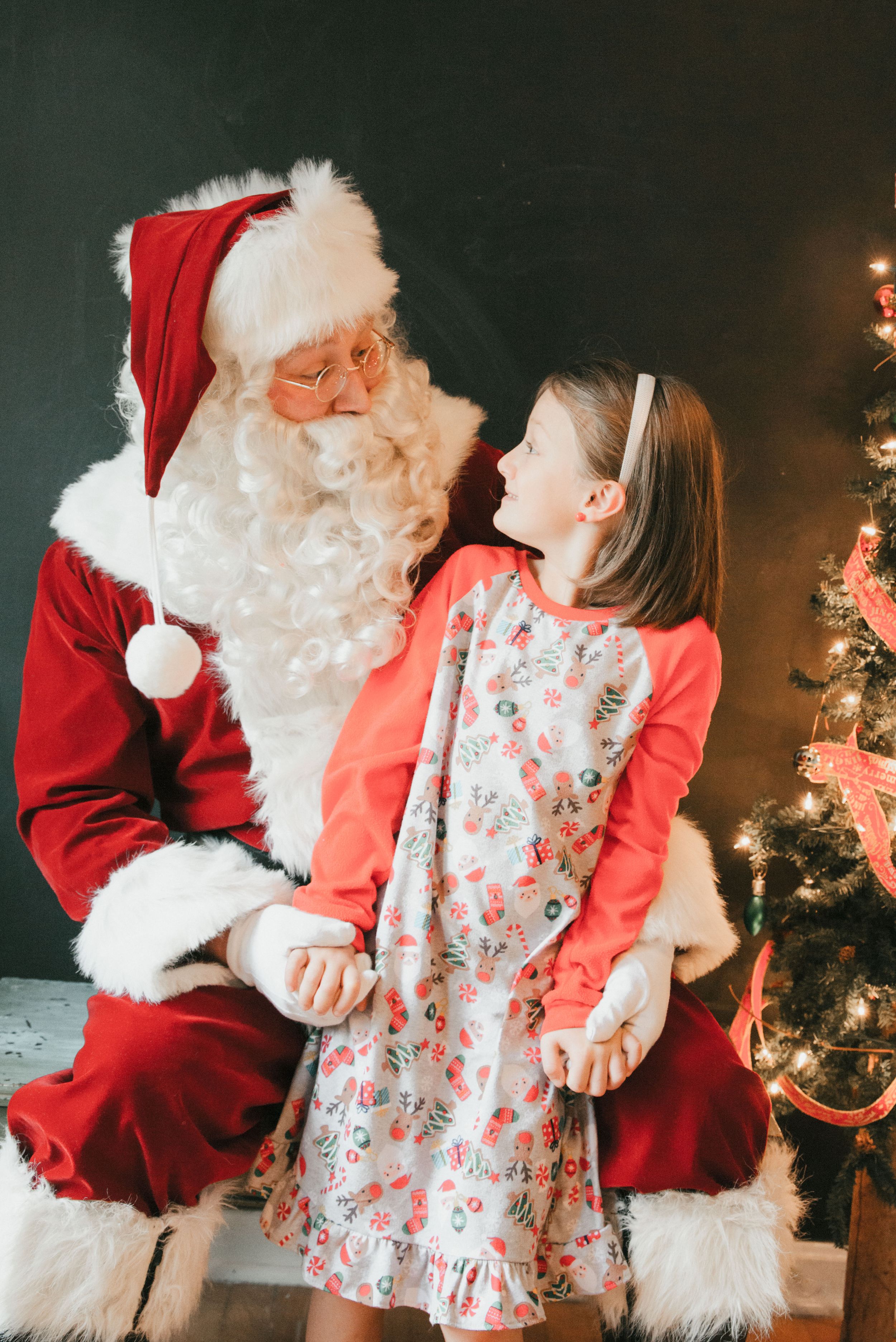 Santa with child in Christmas pajamas, Shiny Penny Studios, Cleveland