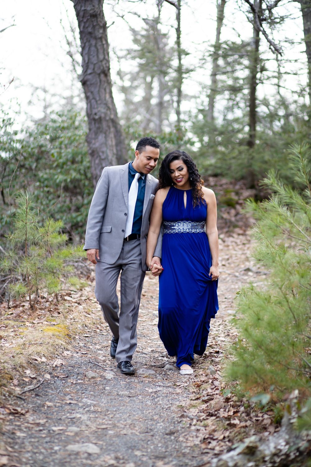 Engaged couple walking in Minnewaska State Park