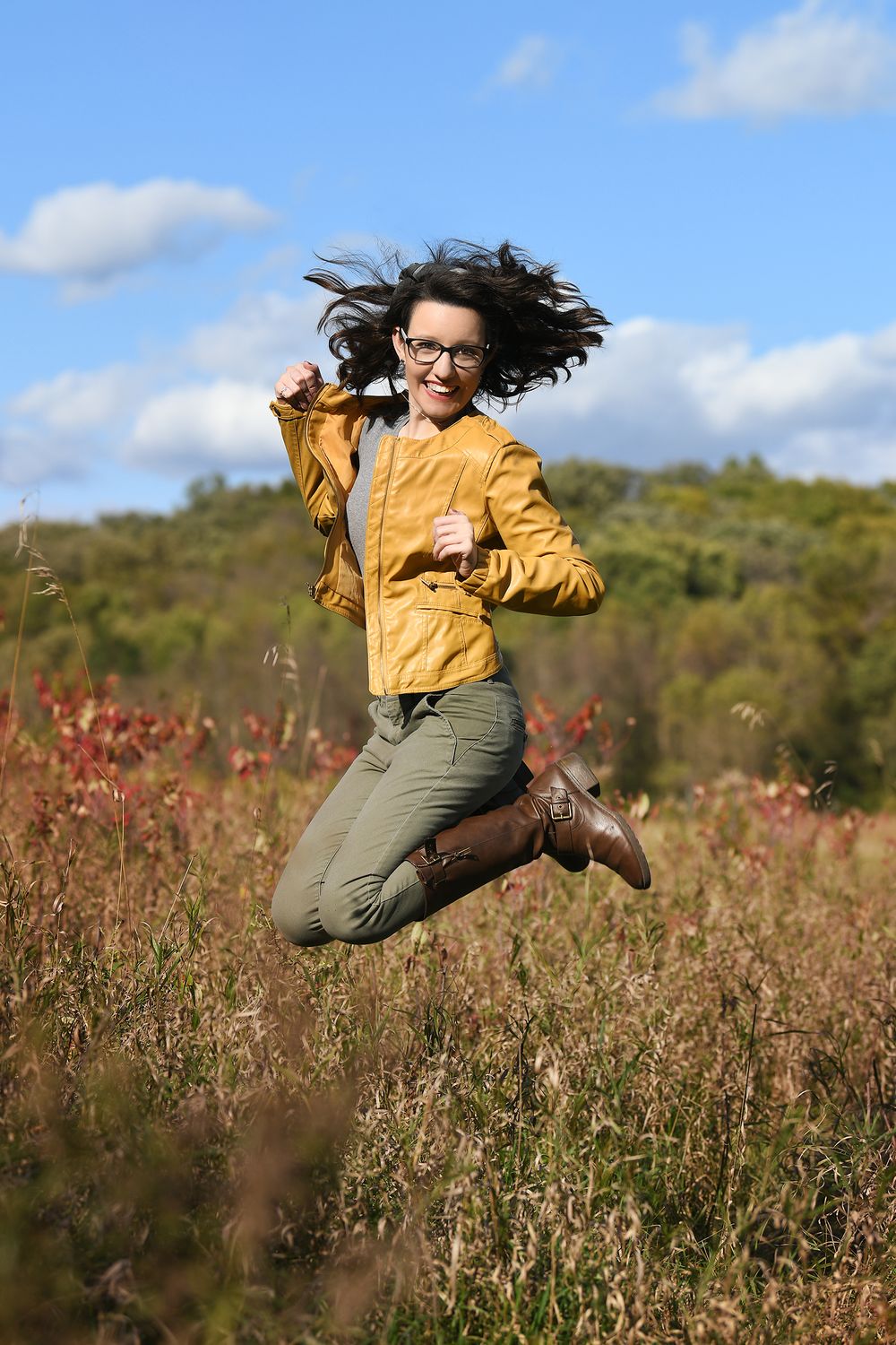 brown leather boots, jumping, mustard yellow leather jacket