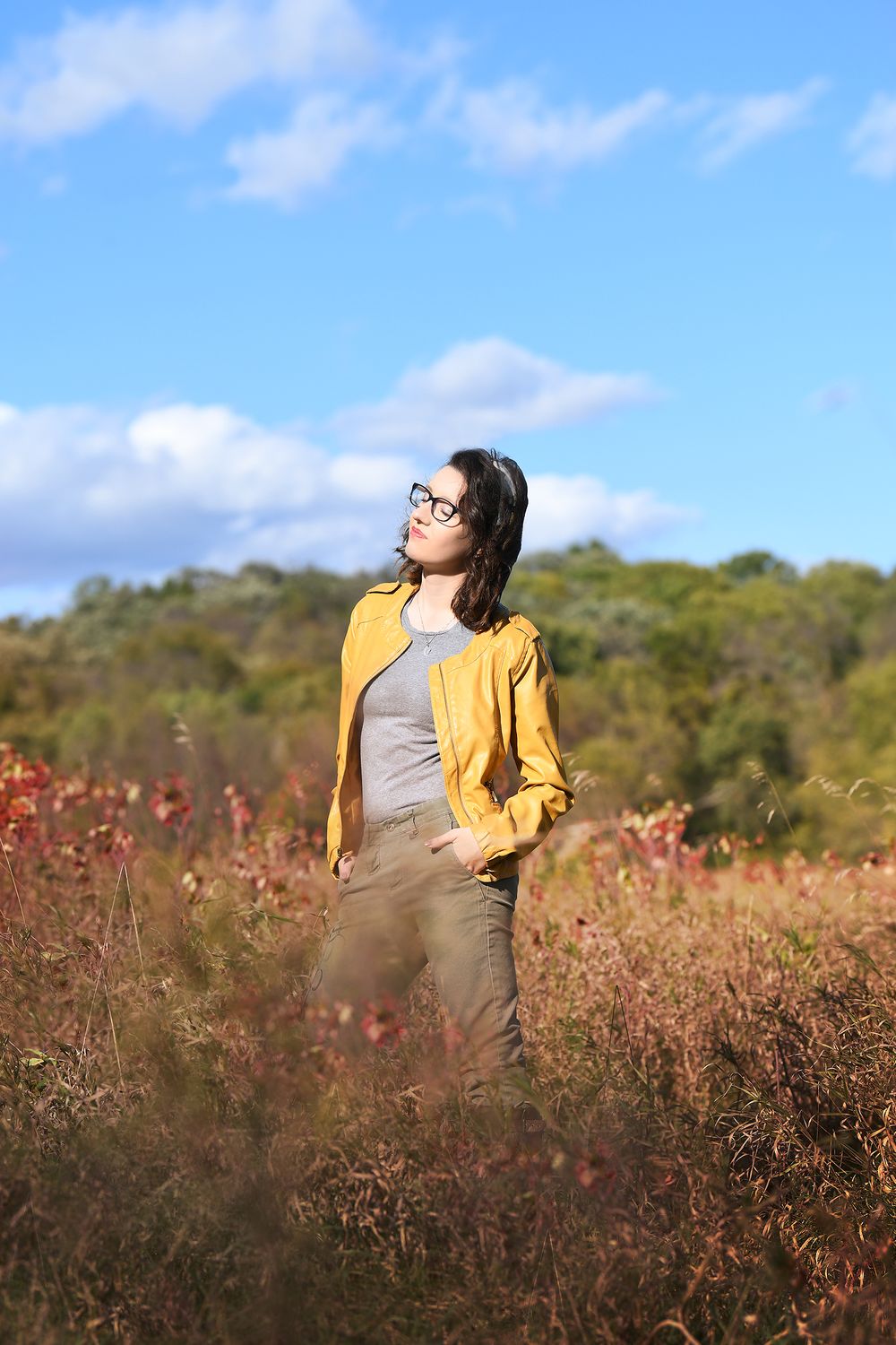 Mustard yellow pleather jacket, blue skies, senior session