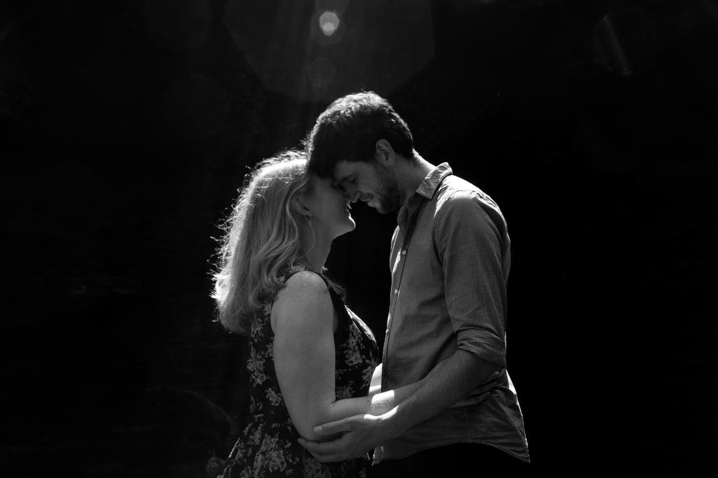 Couple hold each other touching foreheads