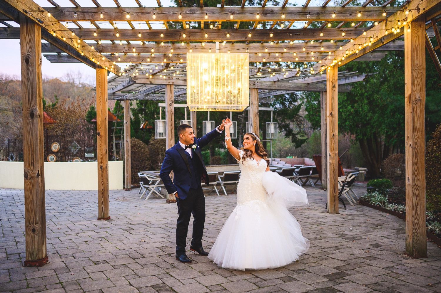 bride and groom dancing at stone house at stirling ridge