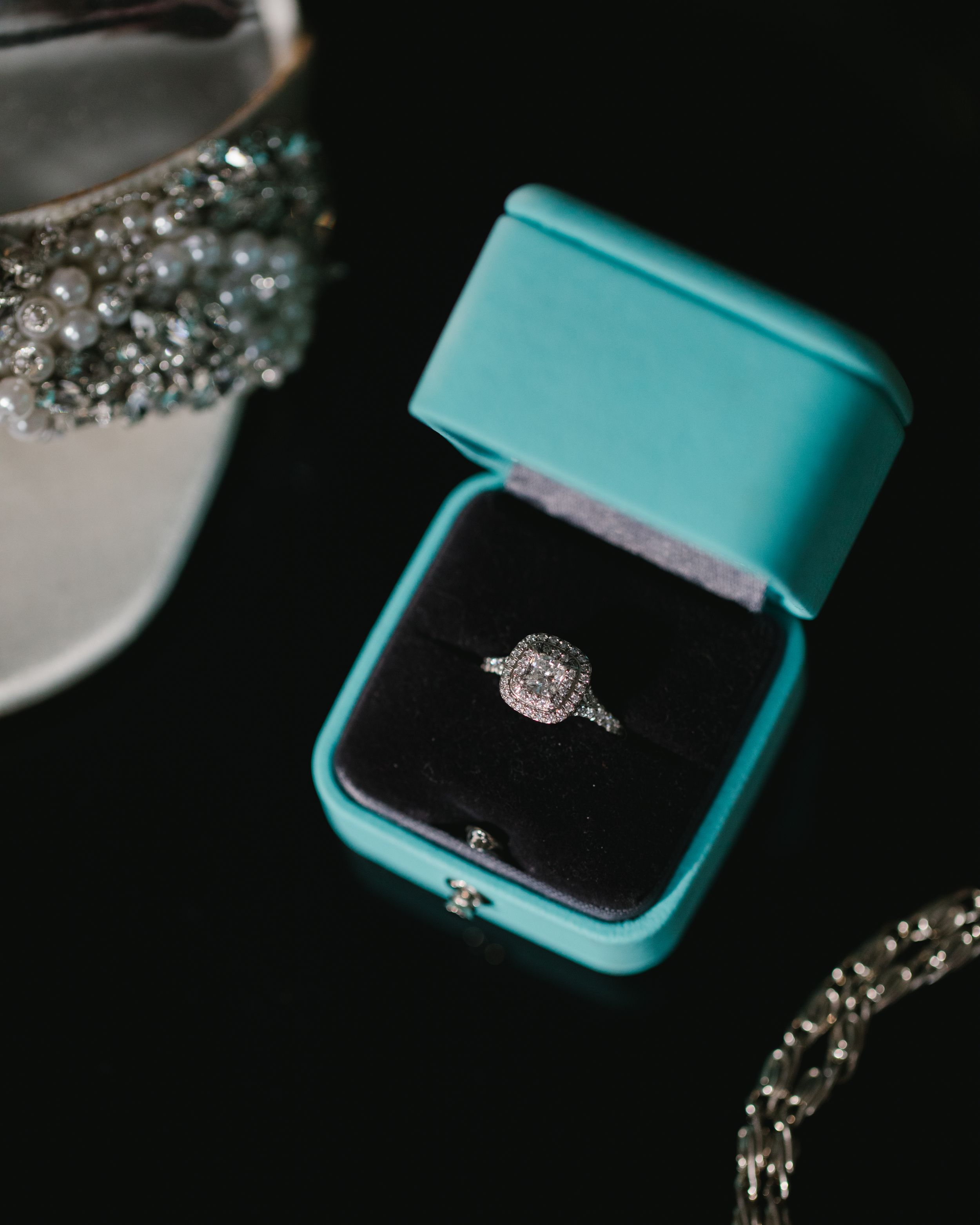 close up of engagement ring in tiffanys box