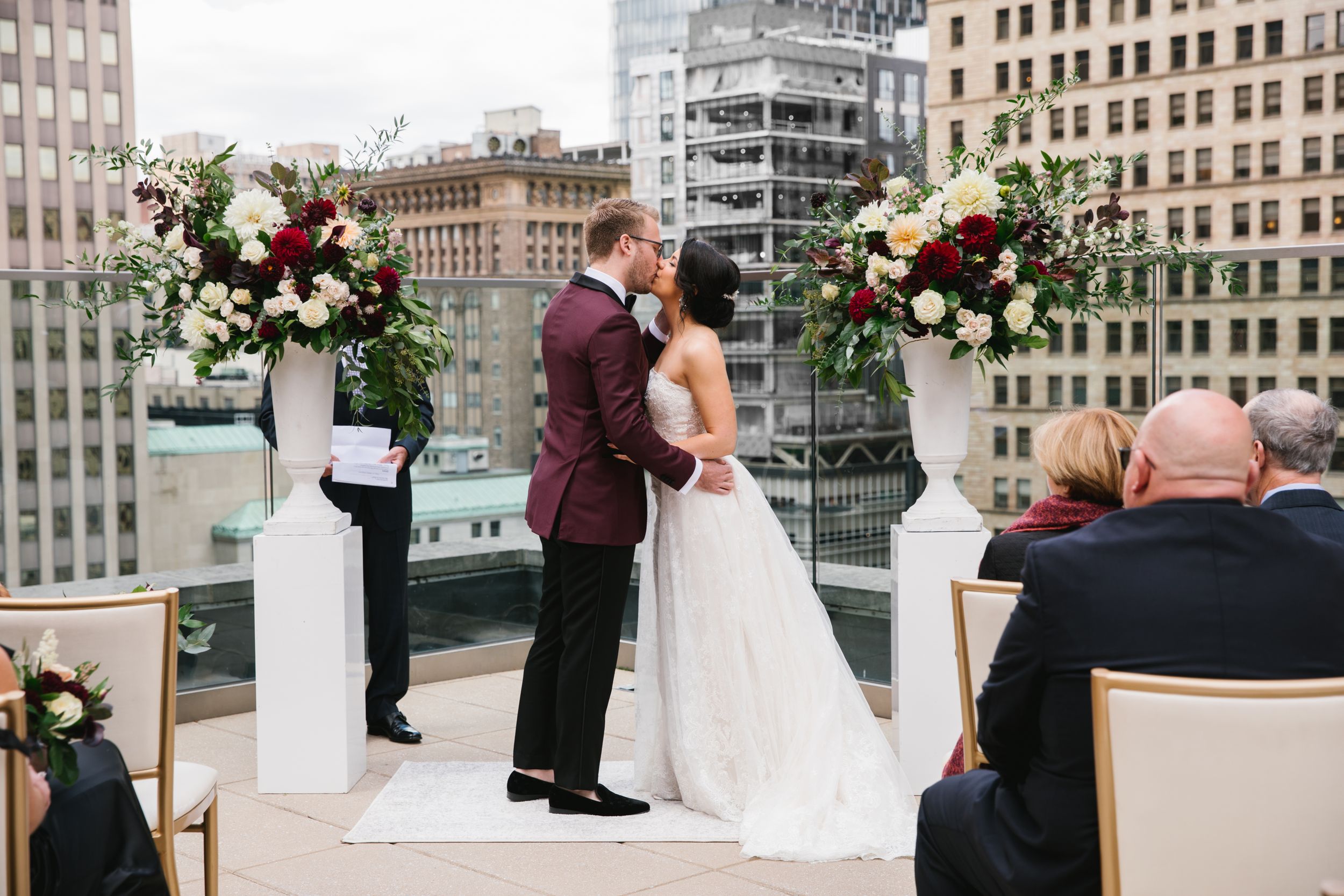 first kiss as husband and wife during rooftop ceremony in toronto ontario city wedding