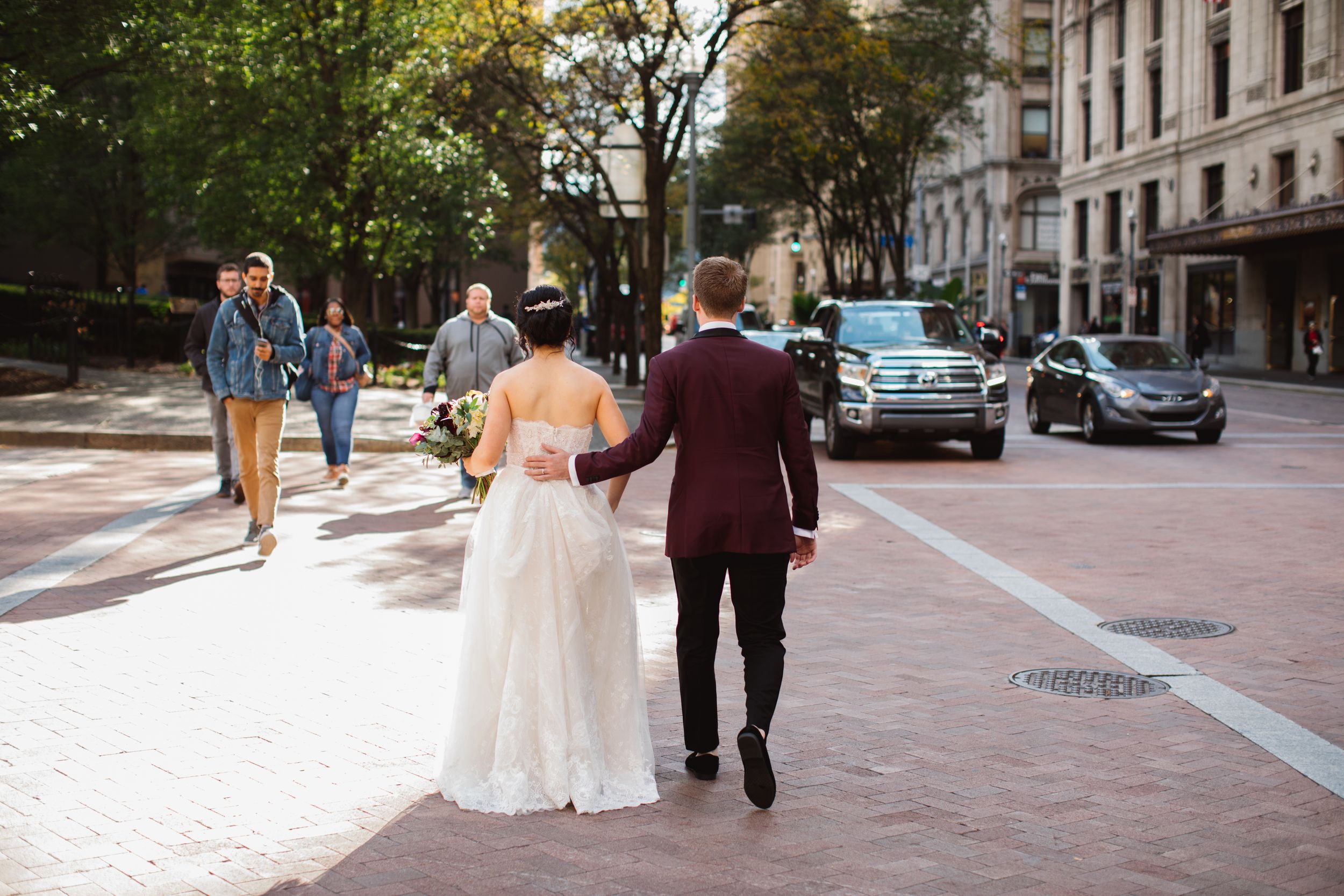bride and groom crossing the street downtown wedding