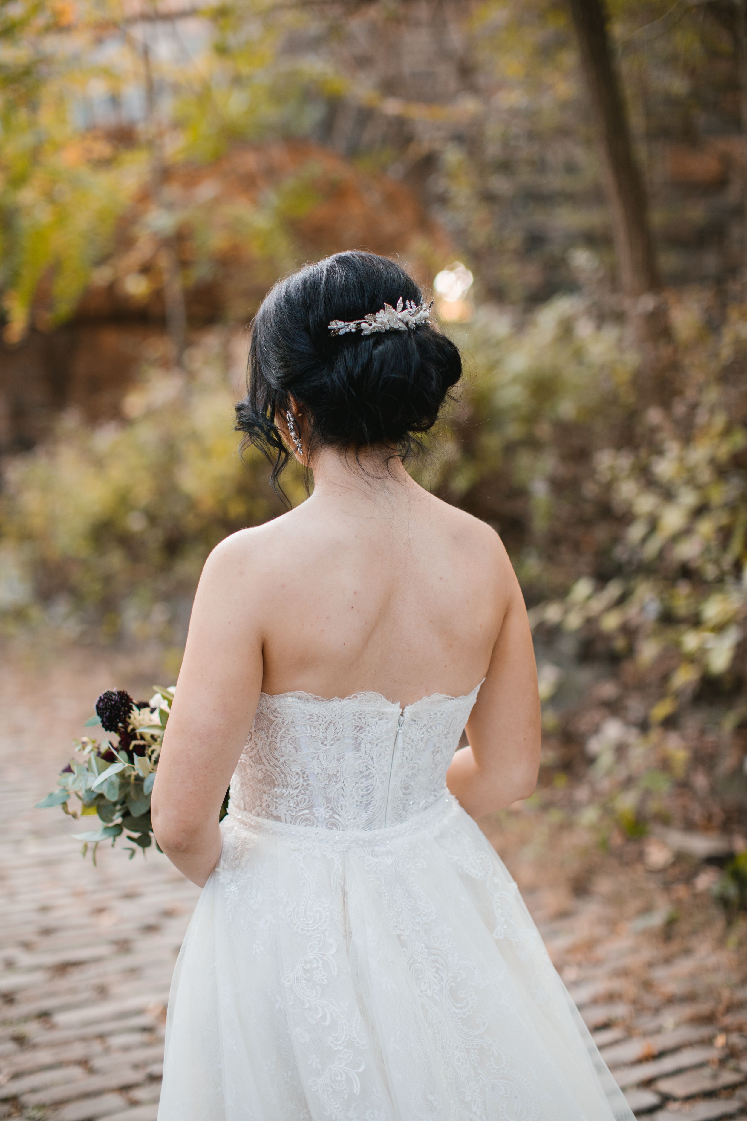 bridal hair and brooch in park during fall
