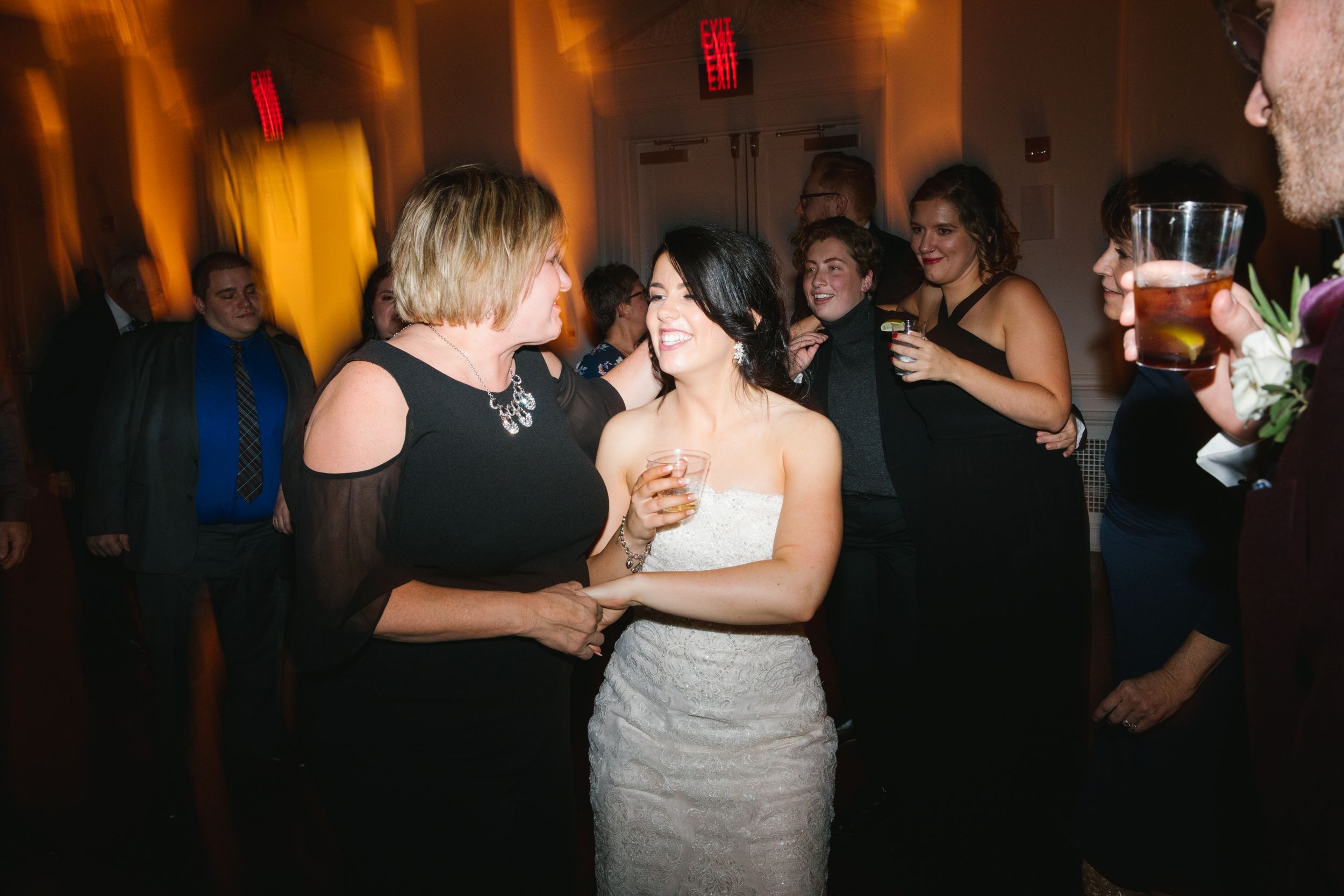 bride dancing with wedding guest during reception