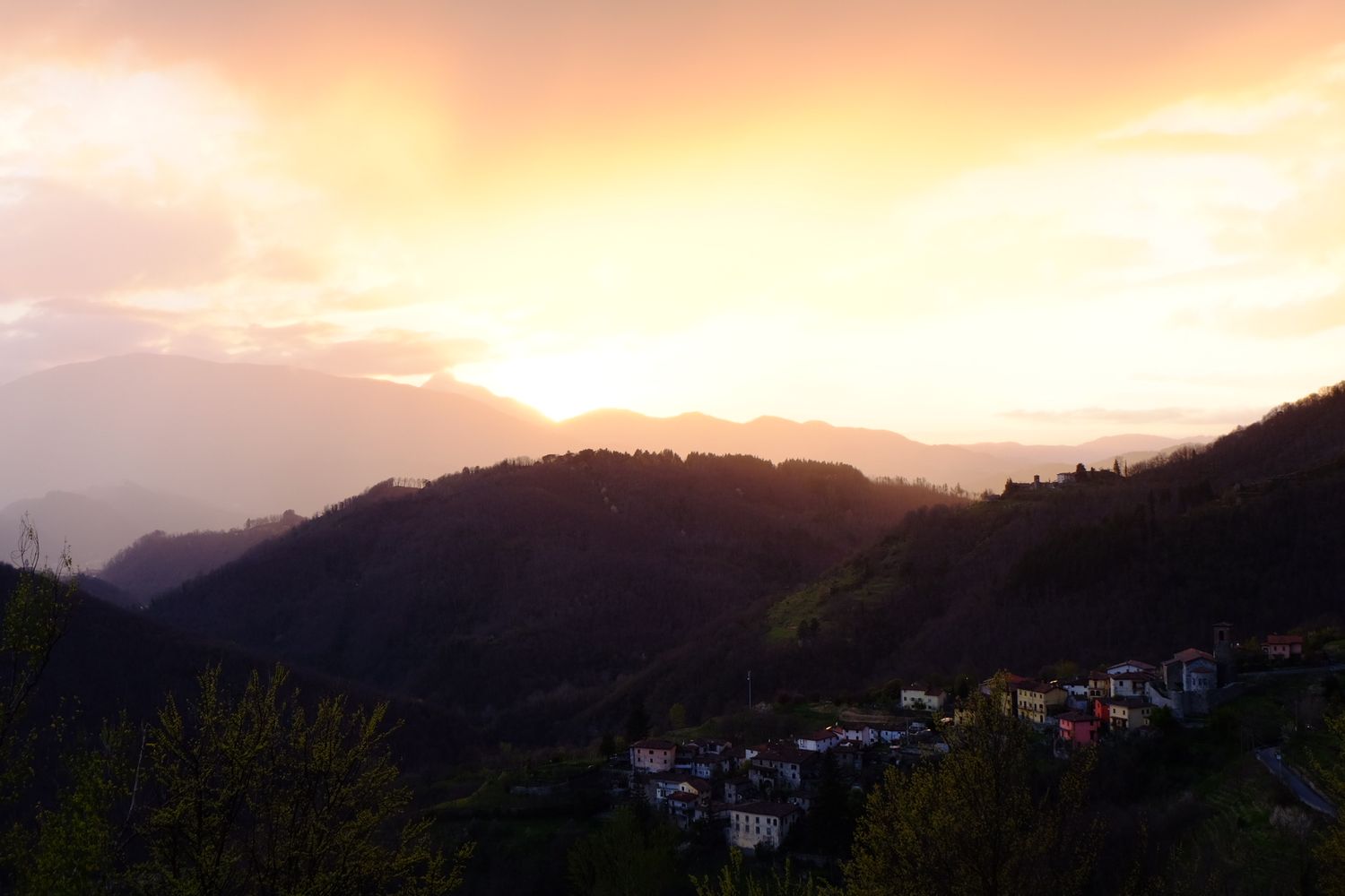 sunset over mountains in Tuscany