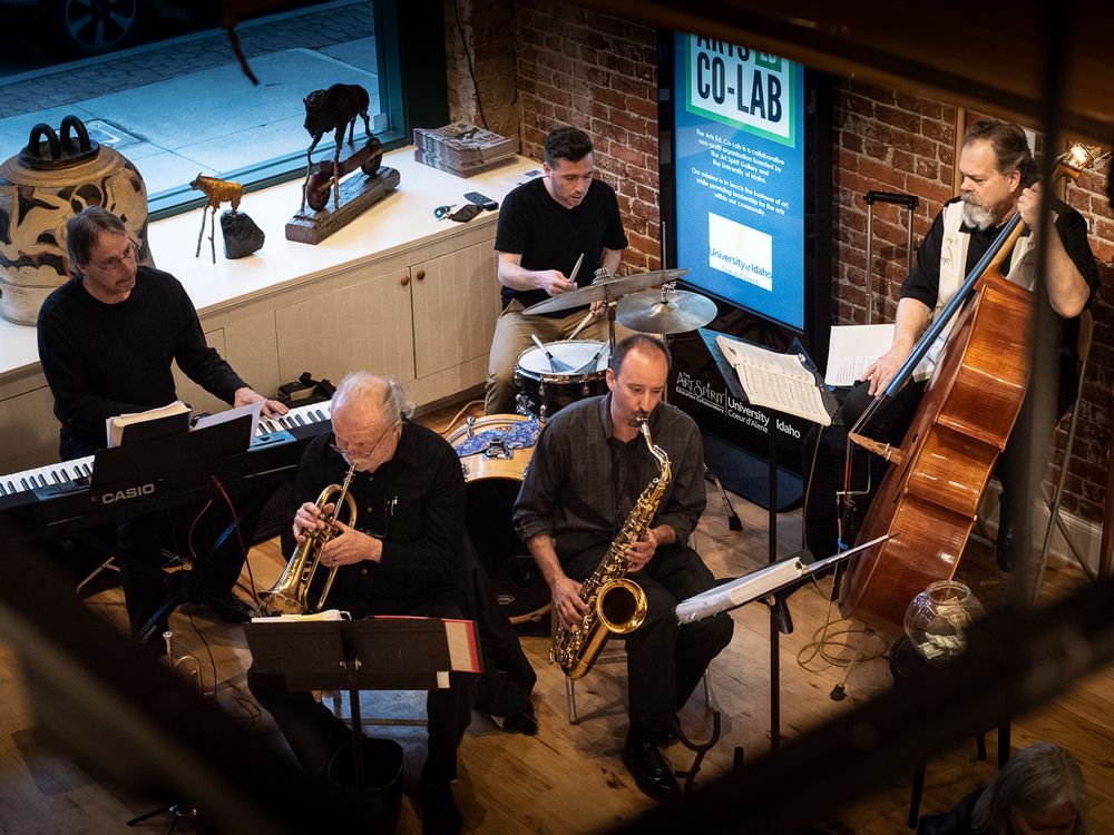 Overhead shot of jazz band playing in art gallery.