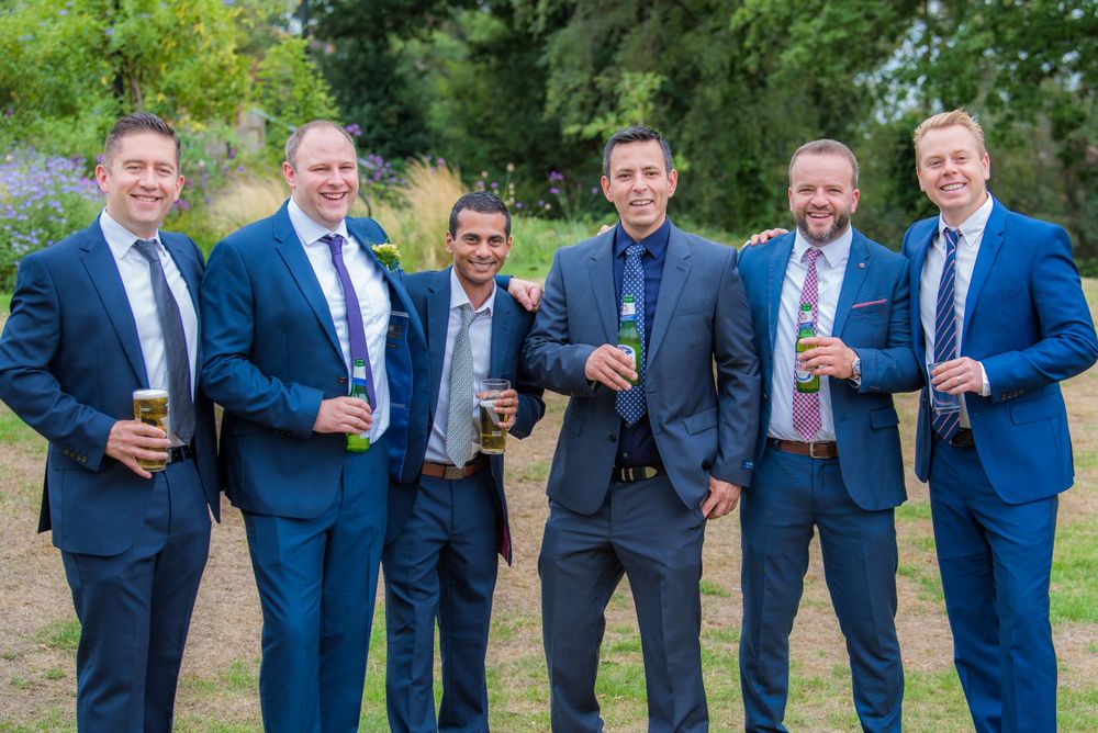 all the groomsmen standing together at Bromley Court Hotel