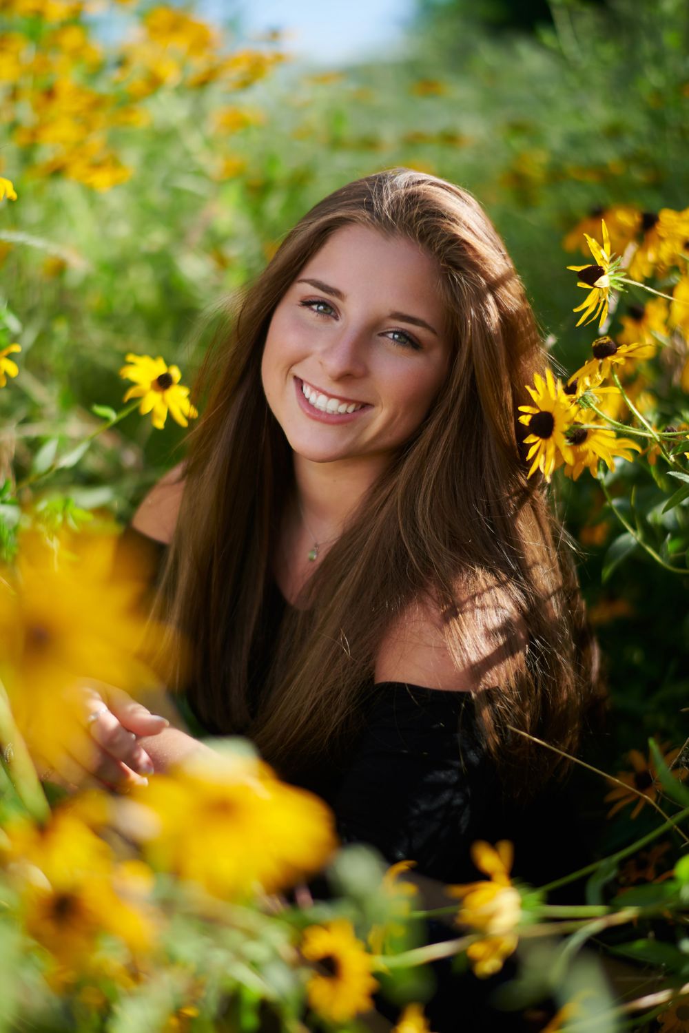Senior picture in flowers near Sibley State Park