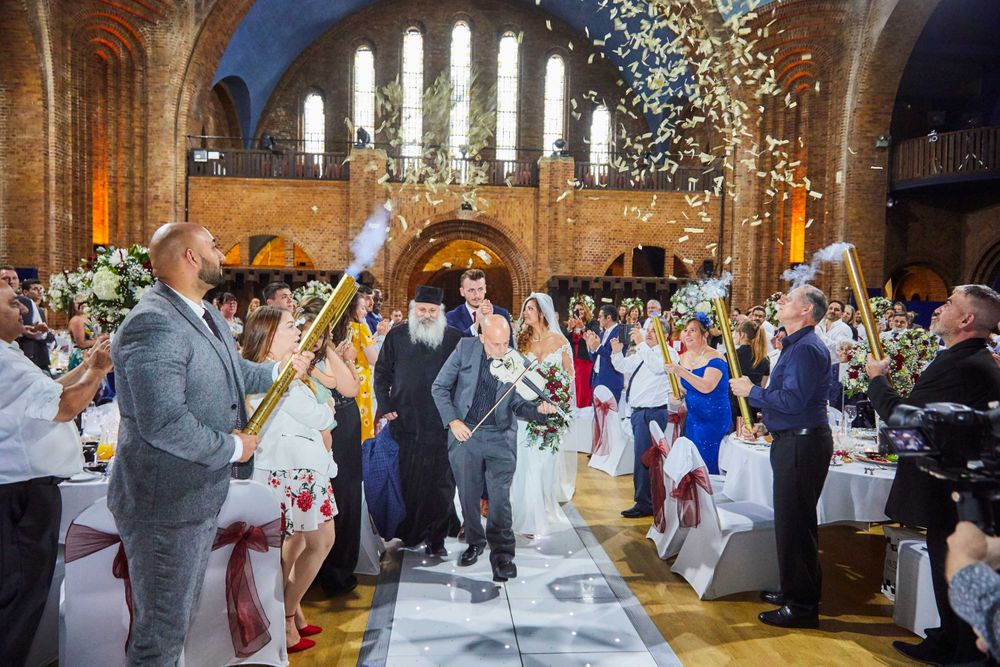Bride and groom showered with confetti