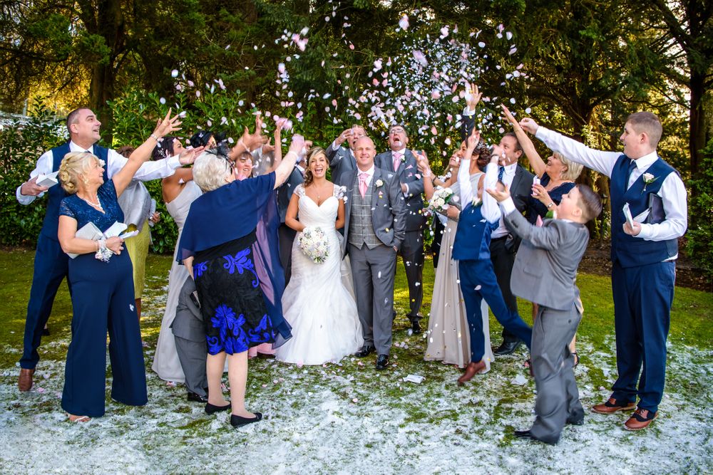 Guests throw confetti at winter wedding in Lake District