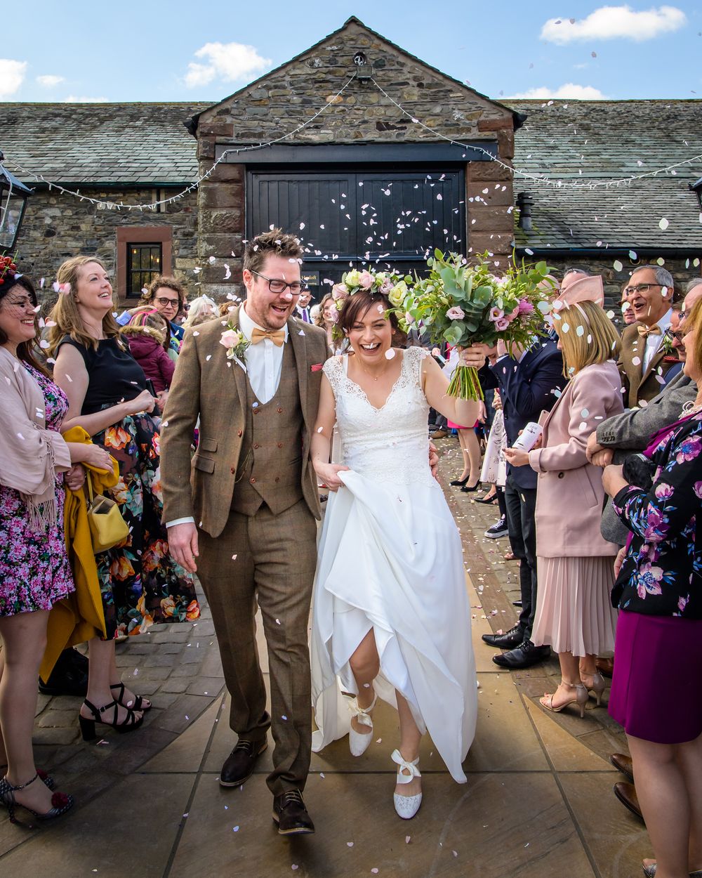 Couple showered with confetti at New House Farm in Lake District