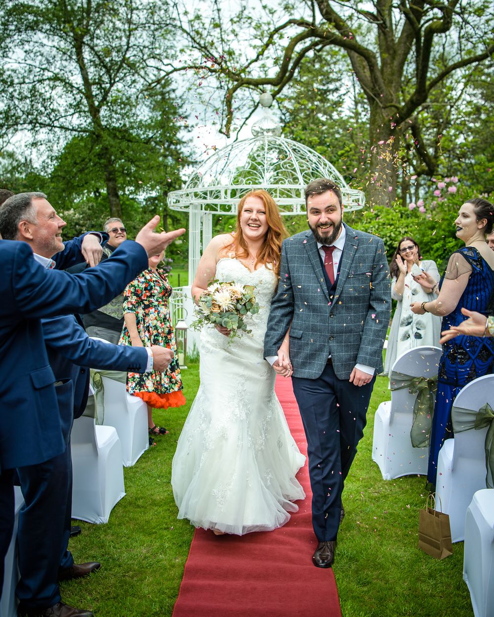 Couple showered with confetti at Wodsworth Hotel in Grasmere