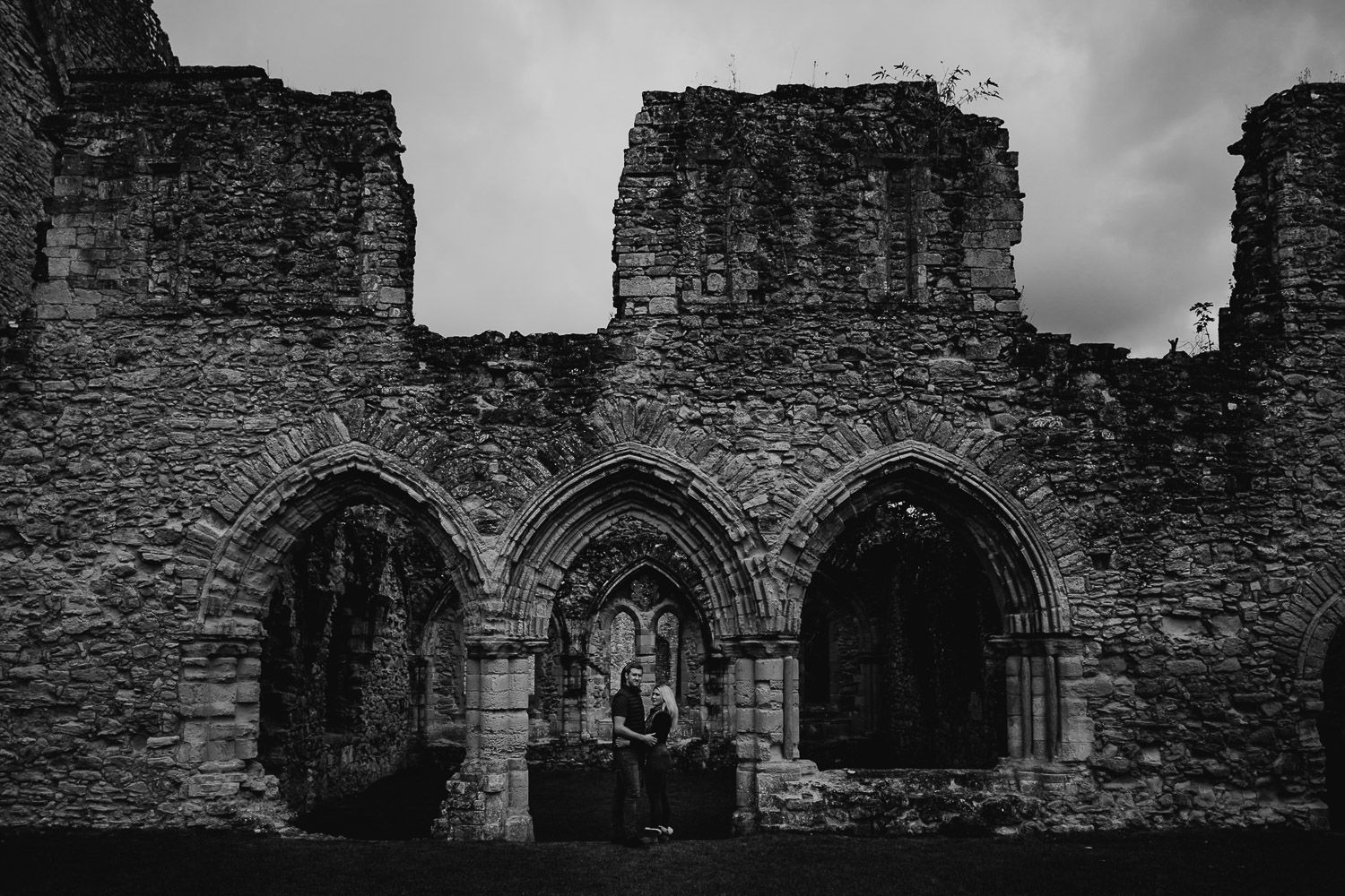 Black and white image of couple at Netley Abbey. Katherine and her Camera engagement photoshoot.