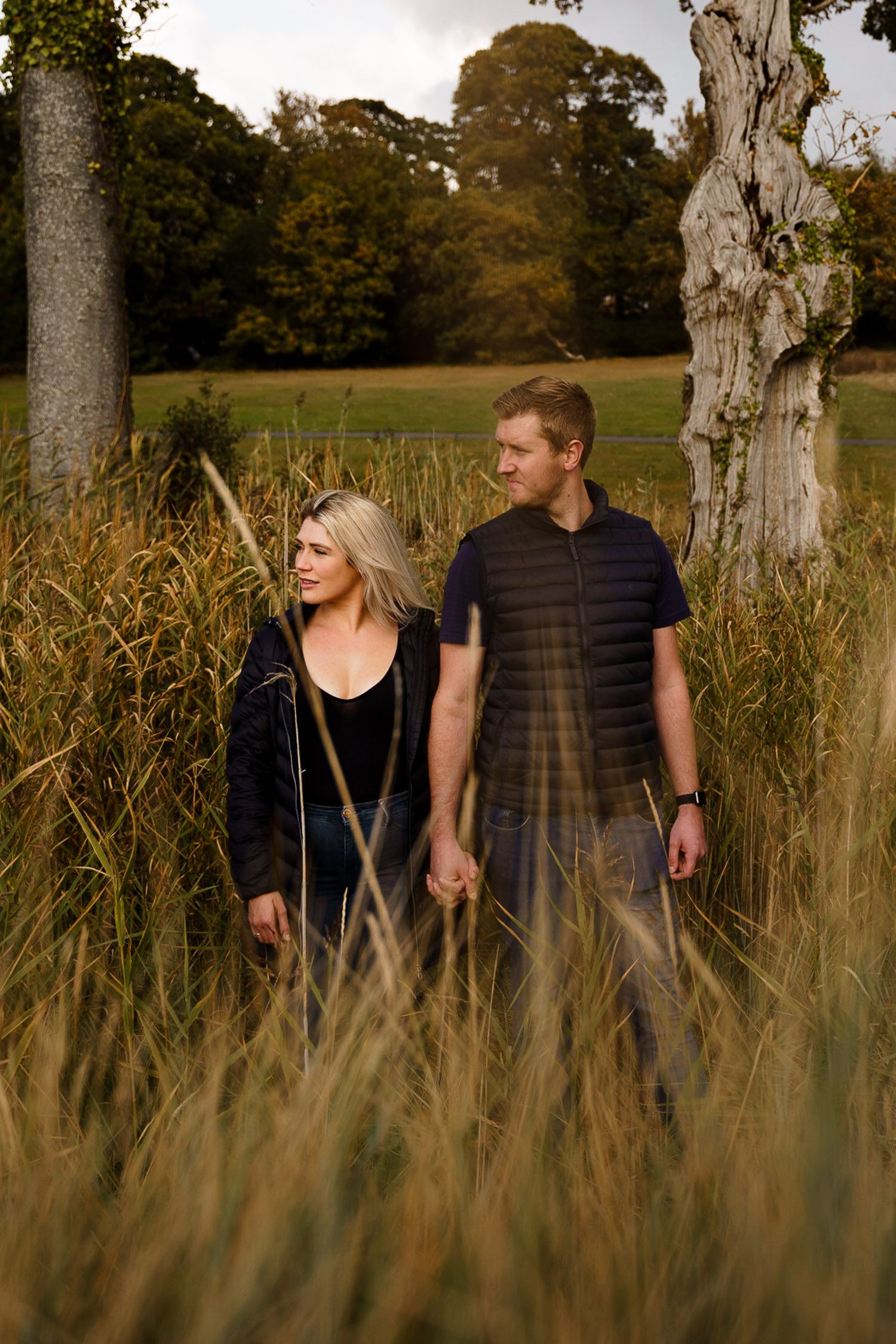 Couple having a pre-wedding photoshoot in a park in autumn. Katherine and her Camera engagement photoshoot.