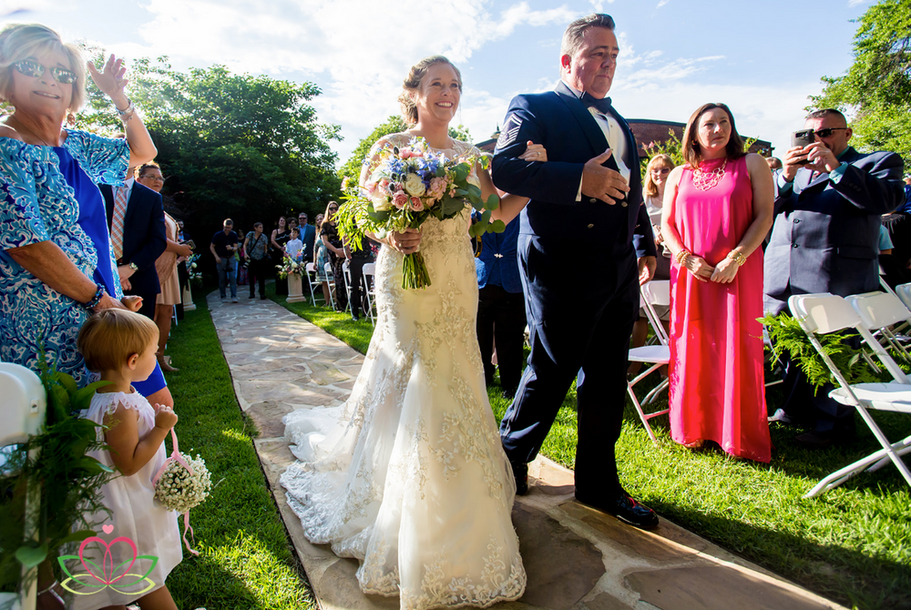 Father of the bride walks his daughter down the aisle during a wedding ceremony at Senate's End in Columbia, SC