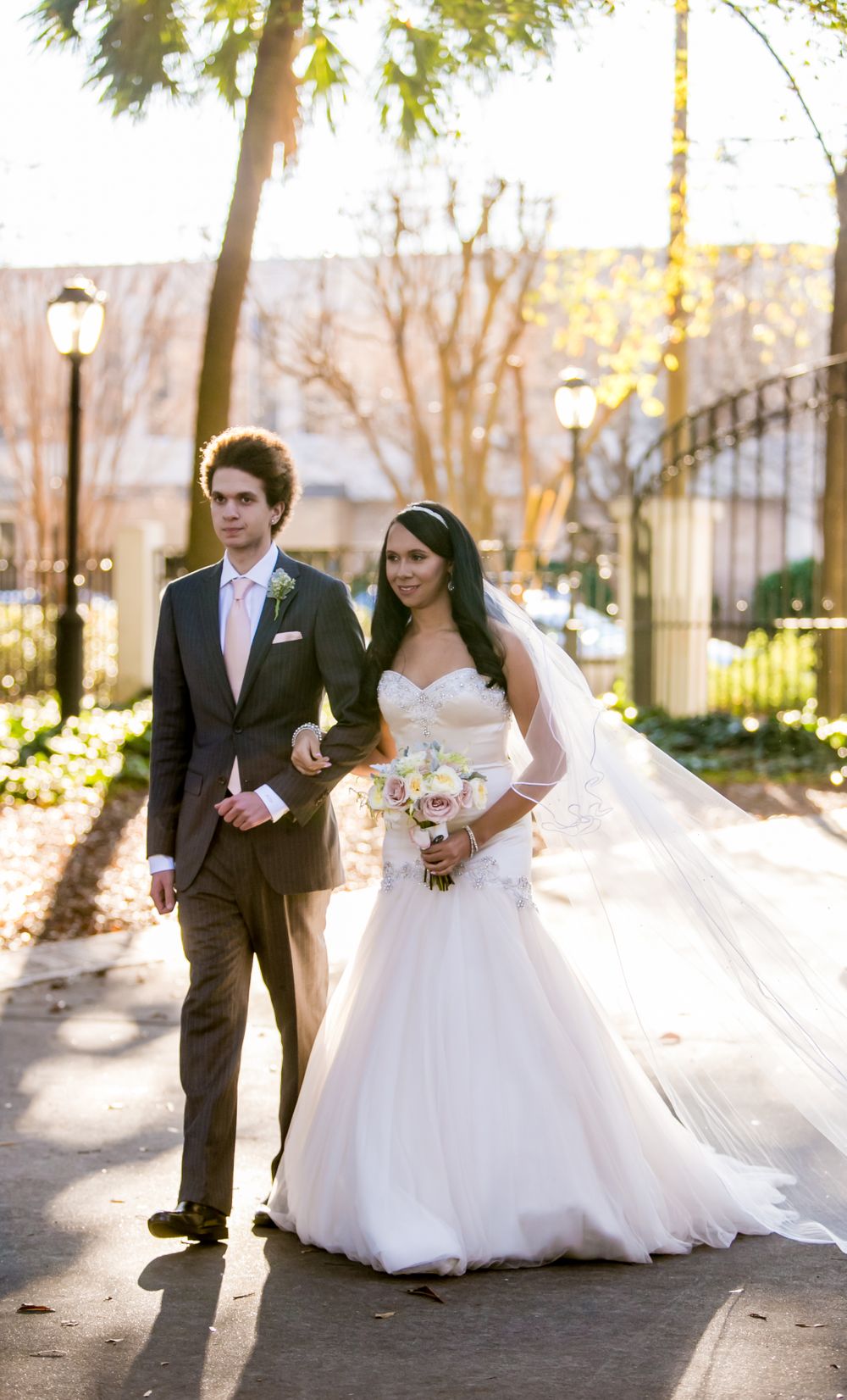 Miranda walks down the aisle with her brother during her wedding at the Lace House in Columbia, SC. Ph
