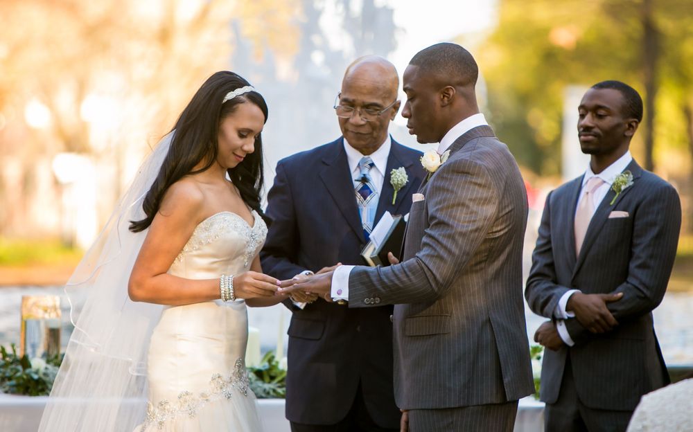 Miranda and Marcus Lattimore during their wedding ceremony at the Lace House in Columbia, SC. Ph