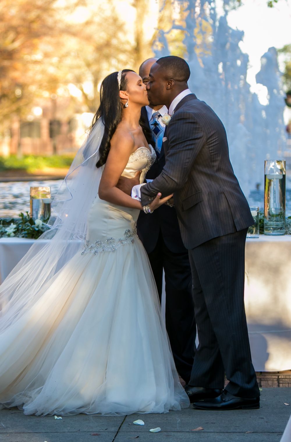 Miranda and Marcus Lattimore's first kiss during their wedding ceremony at the Lace House in Columbia, SC. Ph