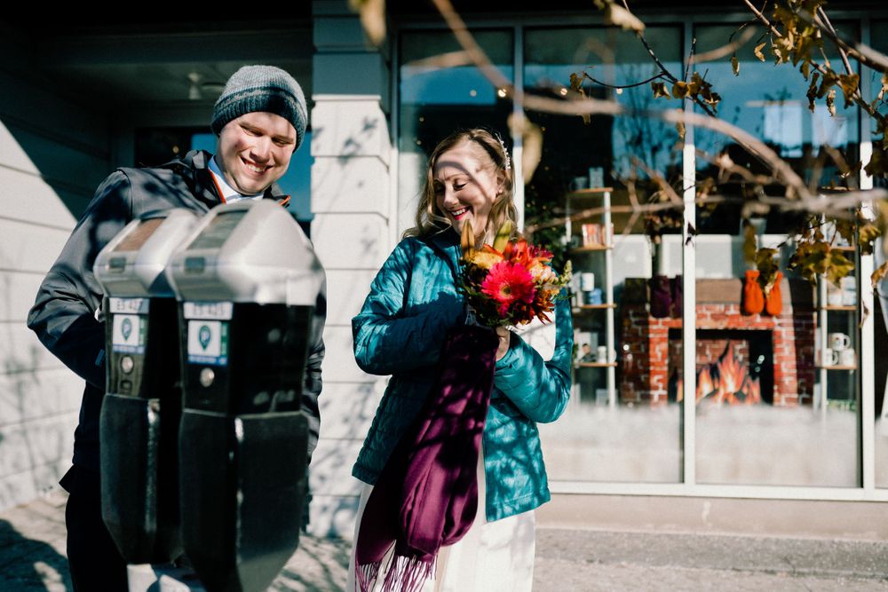bride-groom-paying-meter-elopement-desmoines-iowa-raelyn-ramey-photography