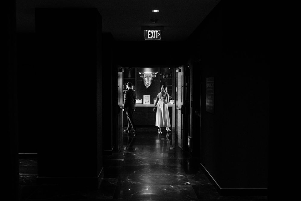 bride-groom-walking-into-the-republic-on-grand-elopement-desmoines-iowa-raelyn-ramey-photography