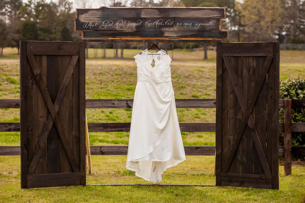 A wedding dress hanging before a wedding ceremony at the Farm at Ridgeway in Ridgeway, SC